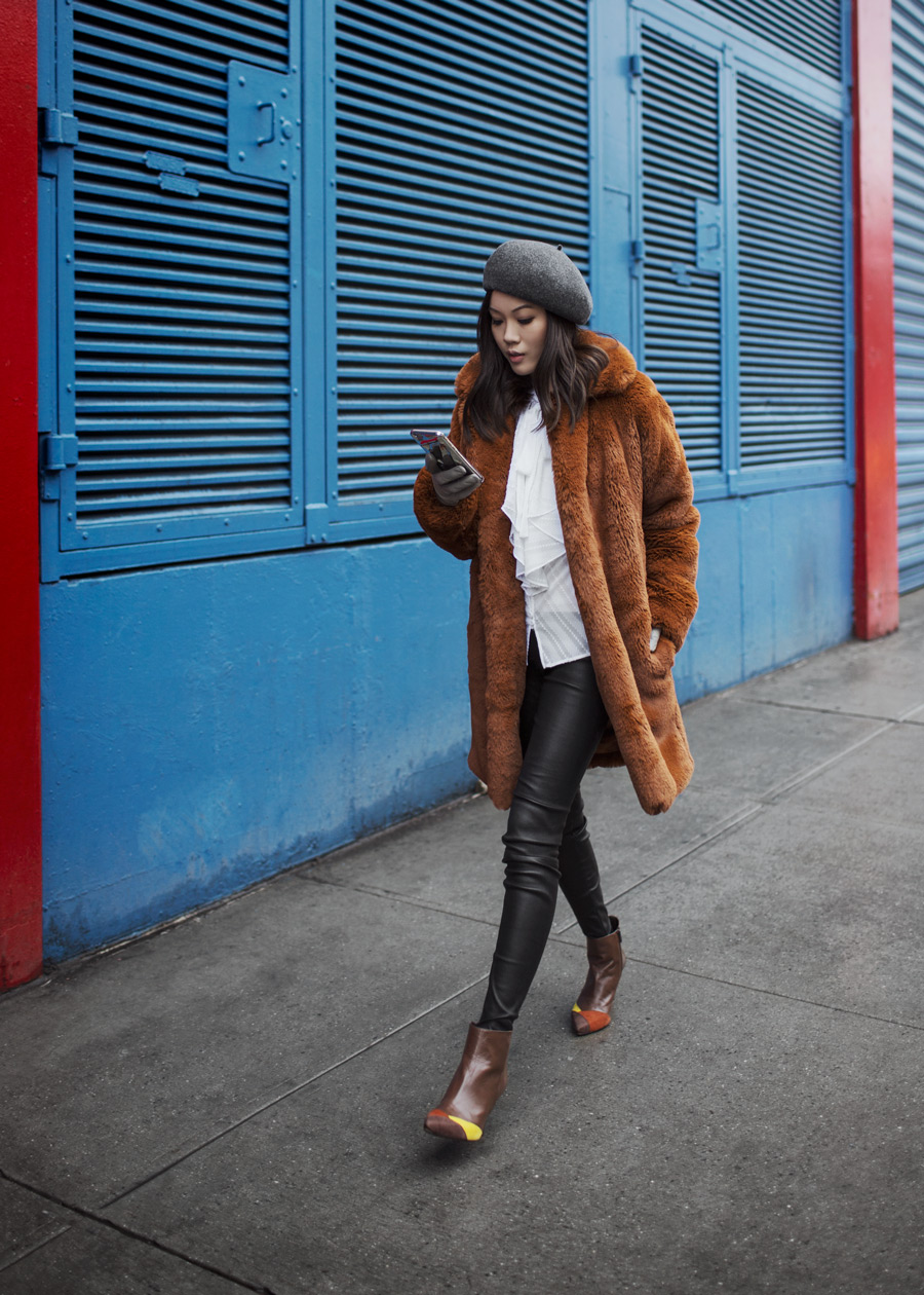 Street style fashion blogger influencer Jenny Tsang of Tsangtastic wearing KAREN MILLEN Teddy Fur Coat, KAREN MILLEN Ruffle Shirt, VINCE Leather Pant, Grey Wool Beret and PERLA FORMENTINI Mia Patchwork Pointy Ankle Boot during New York Fashion Week.