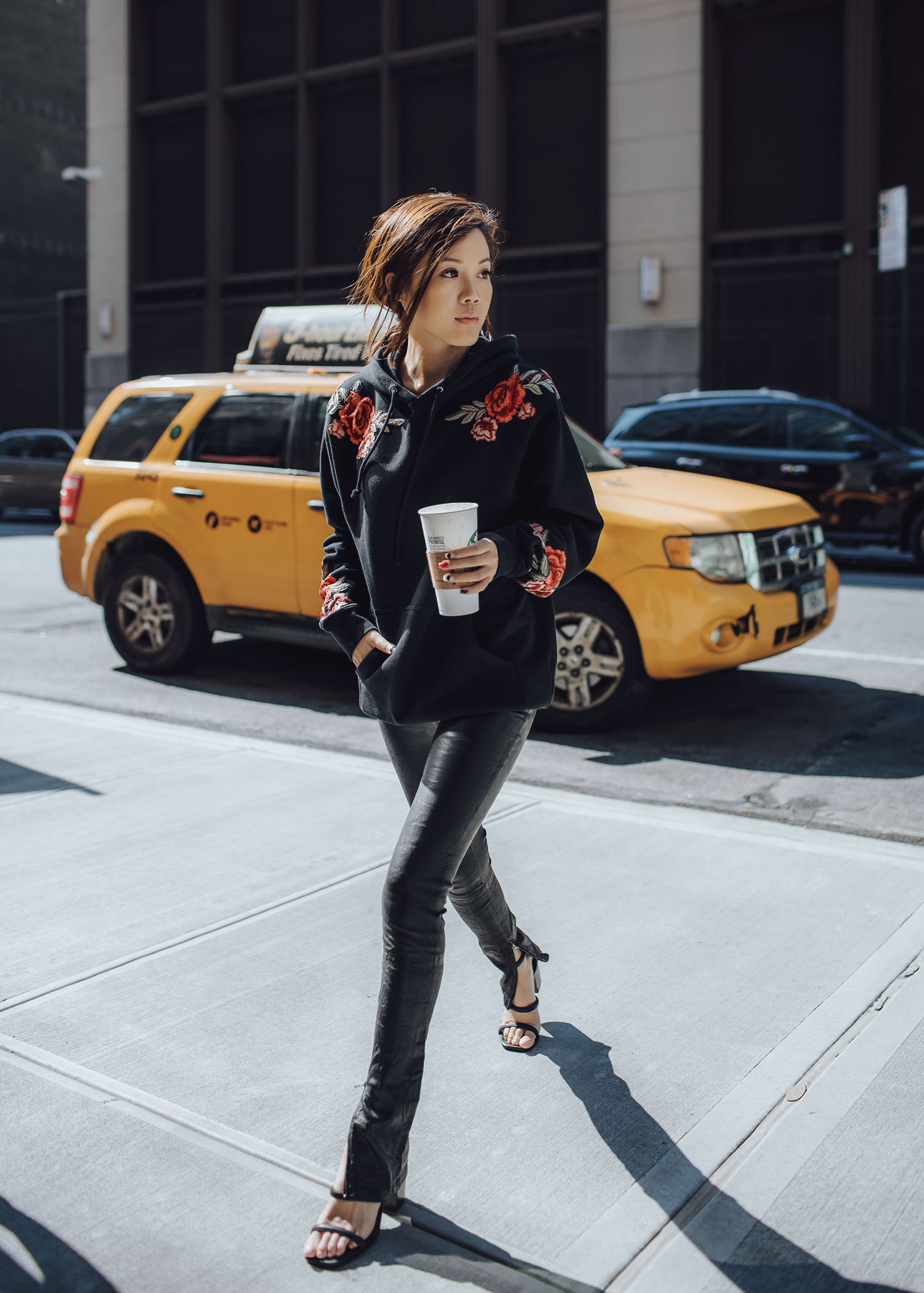 Jenny Tsang of Tsangtastic wearing floral patch sweatshirt ankle zip leather pant velvet military jacket red ruffle sweater and blue leather newsboy cap