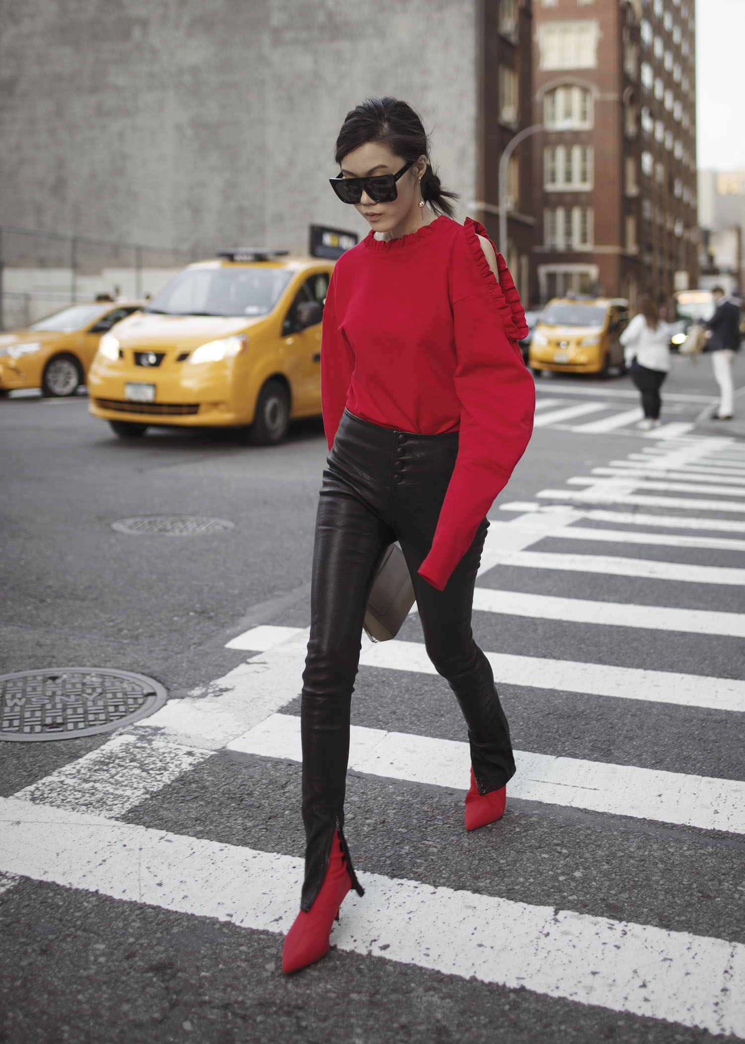 Jenny Tsang of Tsangtastic wearing floral patch sweatshirt ankle zip leather pant velvet military jacket red ruffle sweater and blue leather newsboy cap