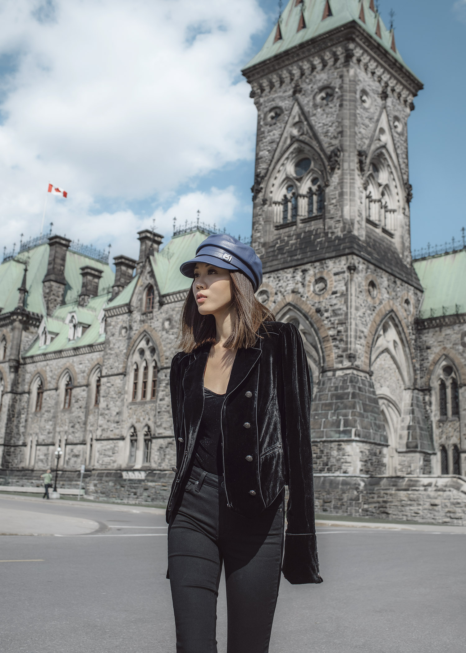 Jenny Tsang of Tsangtastic wearing floral patch sweatshirt ankle zip leather pant velvet military jacket red ruffle sweater and blue leather newsboy cap