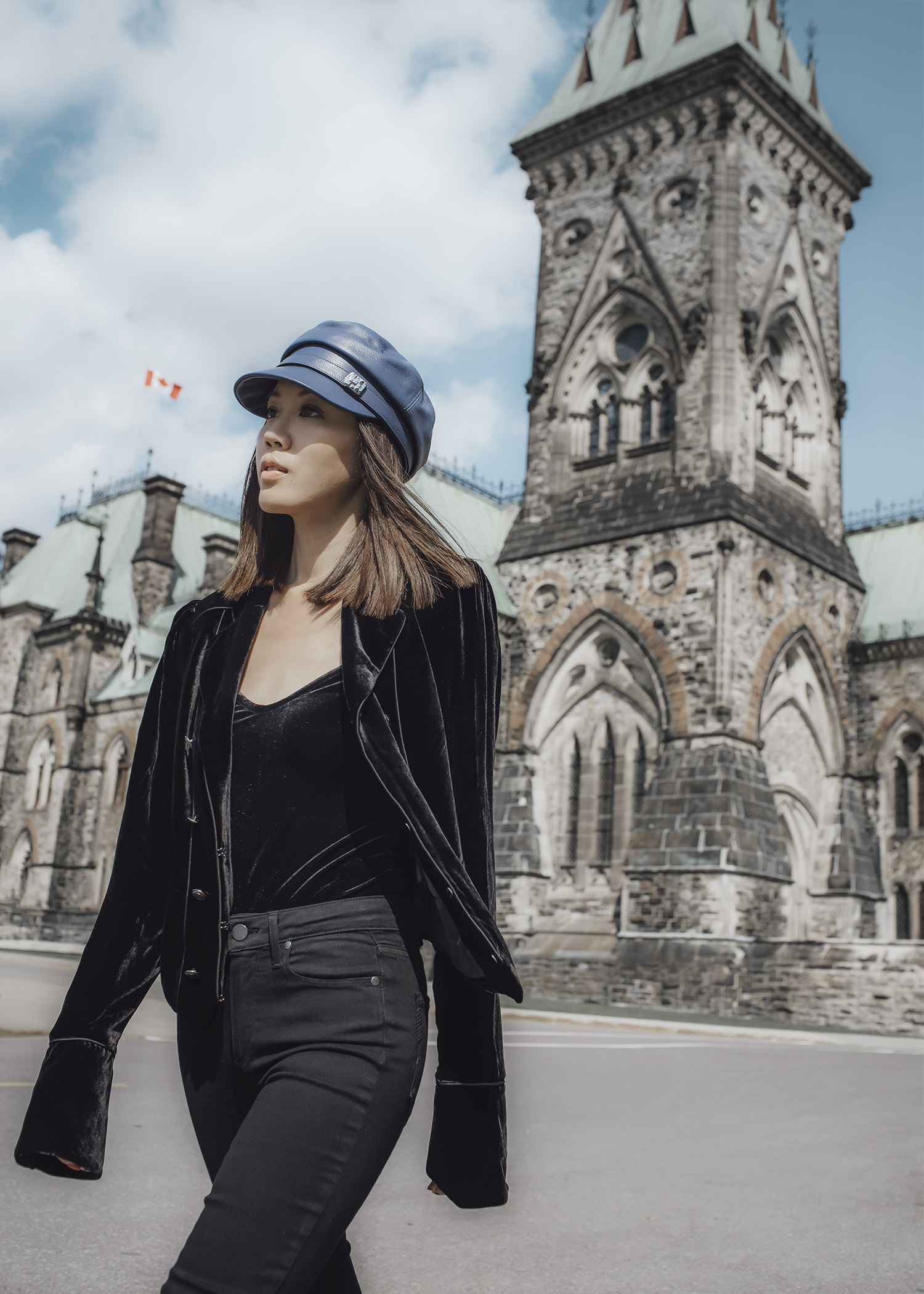 Jenny Tsang of Tsangtastic wearing floral patch sweatshirt ankle zip leather pant velvet military jacket red ruffle sweater and blue leather newsboy cap