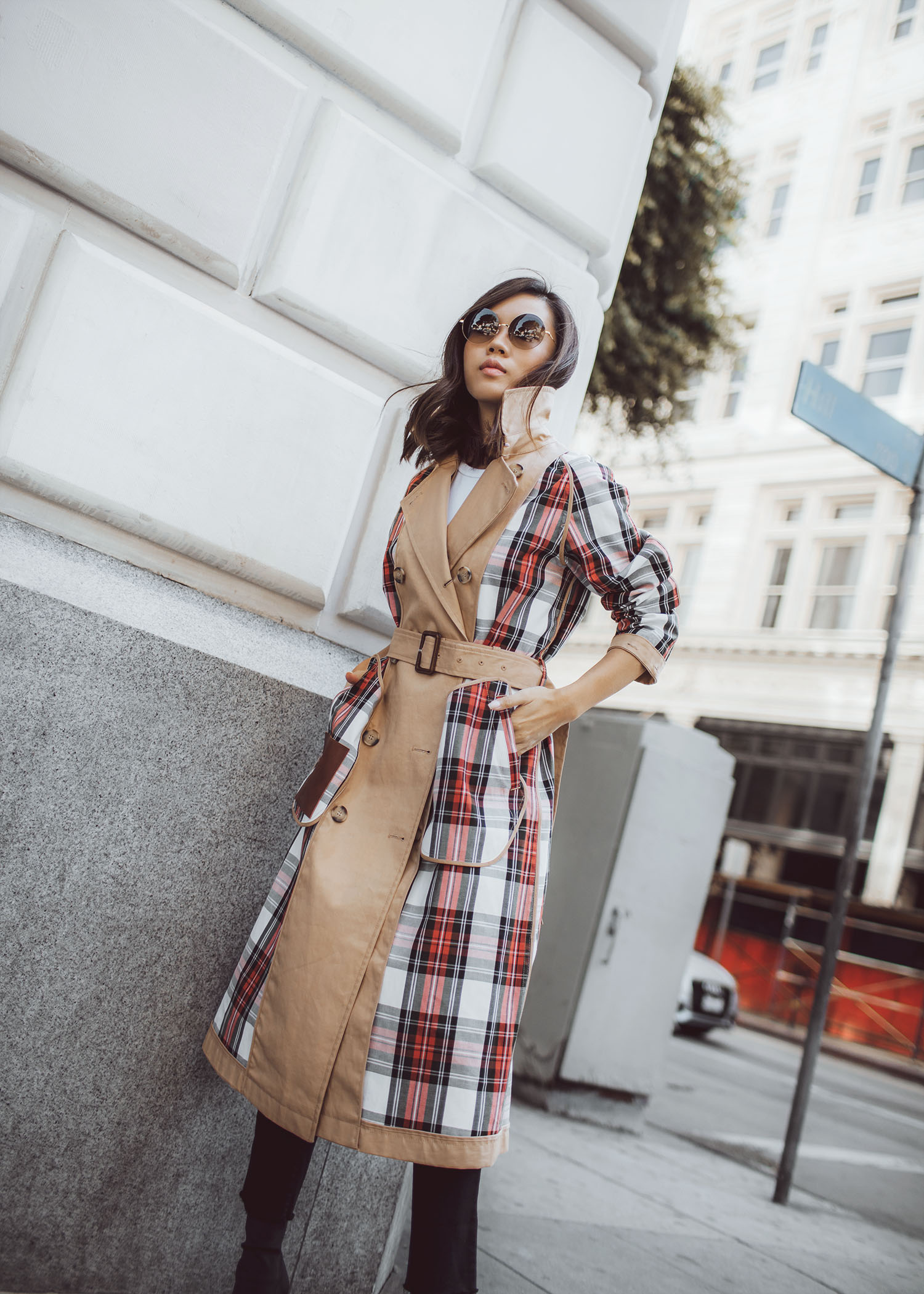 Jenny Tsang of Tsangtastic wearing uniqlo jw anderson trench coat and victoria beckham rounded sunglasses