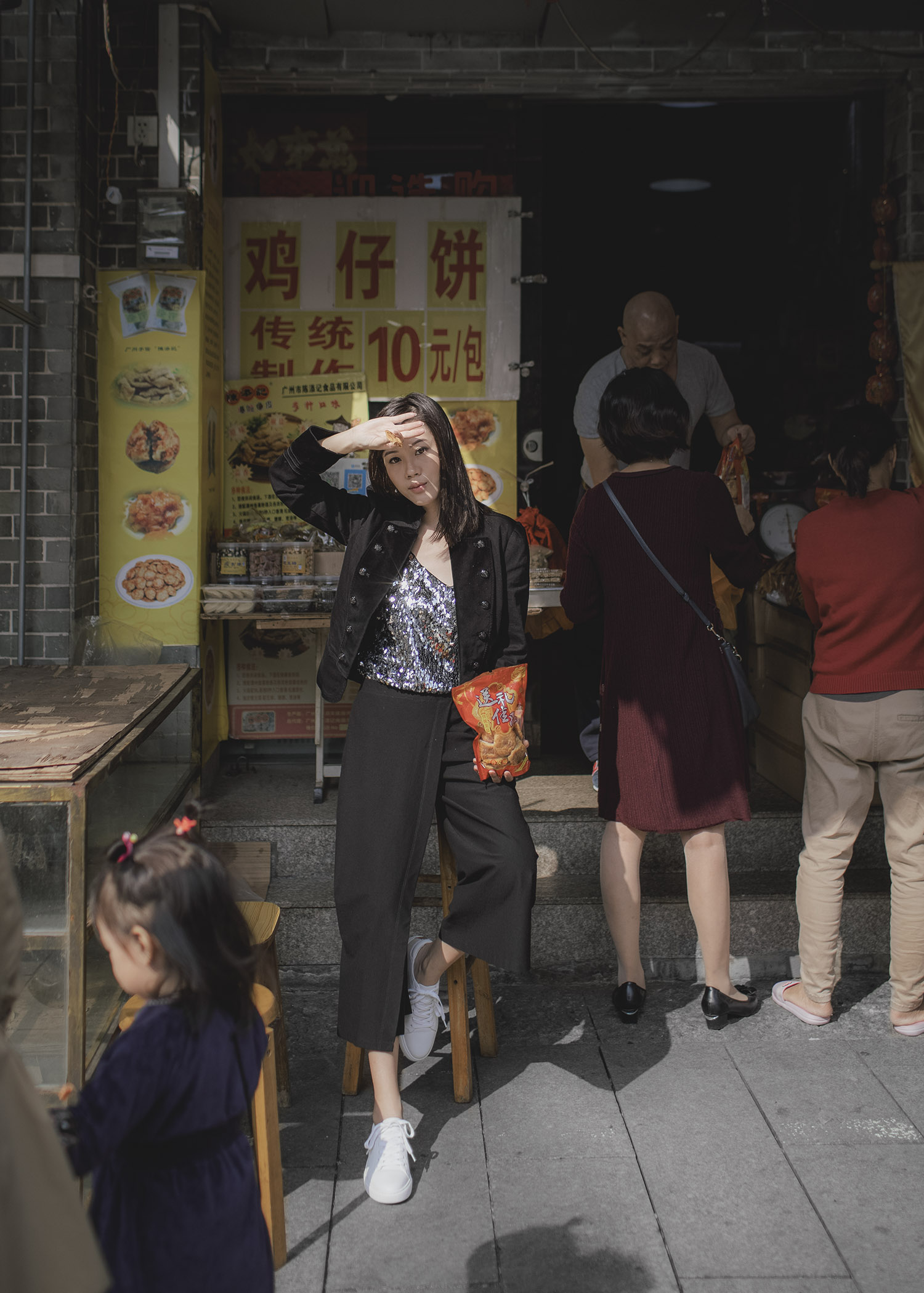 Jenny Tsang of Tsangtastic wearing sequins camisole military blazer asymmetrical culottes and white sneakers 