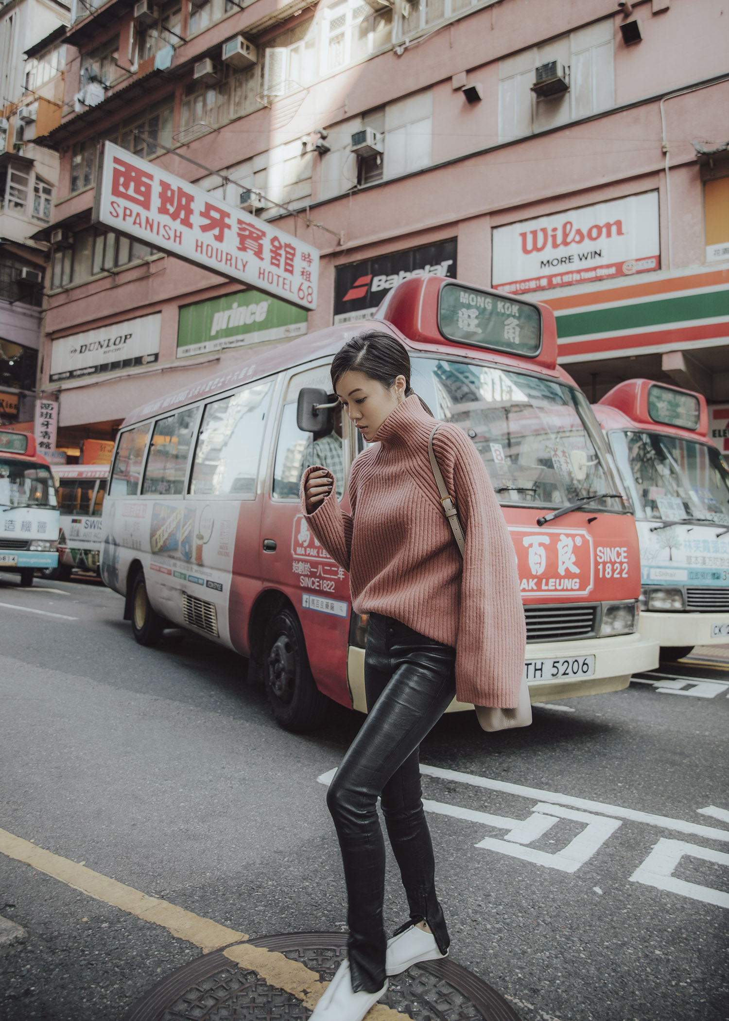 Jenny Tsang of Tsangtastic wearing byTSANG rosy structured knit and leather pants in Mong Kok Hong Kong