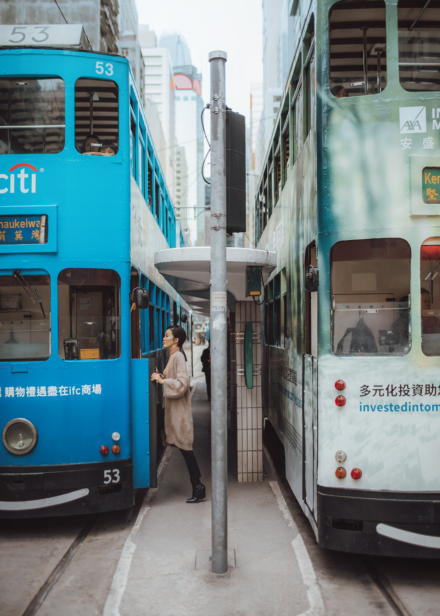 Jenny Tsang of Tsangtastic wearing bytsang fuzzy cardigan coat in Hong Kong Central riding the tram