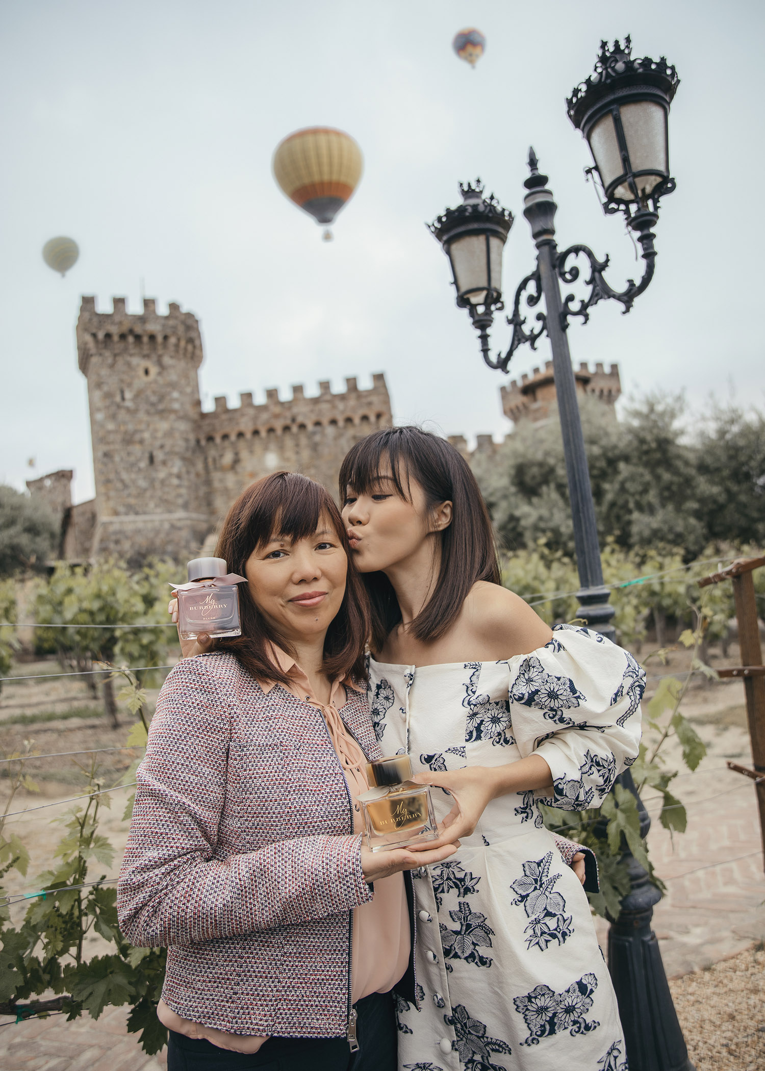 Jenny Tsang of Tsangtastic in Napa Valley castle with Burberry My Burberry Classic My Burberry Blush fragrance wearing Sea NYC dress