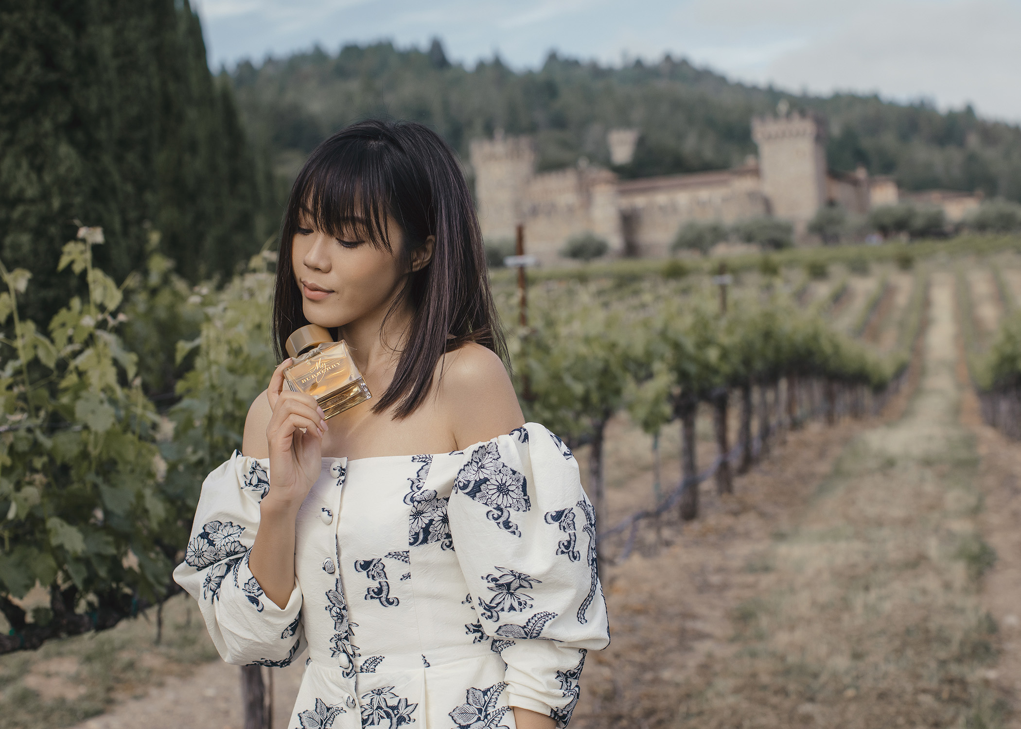 Jenny Tsang of Tsangtastic in Napa Valley castle with Burberry My Burberry Classic My Burberry Blush fragrance wearing Sea NYC dress