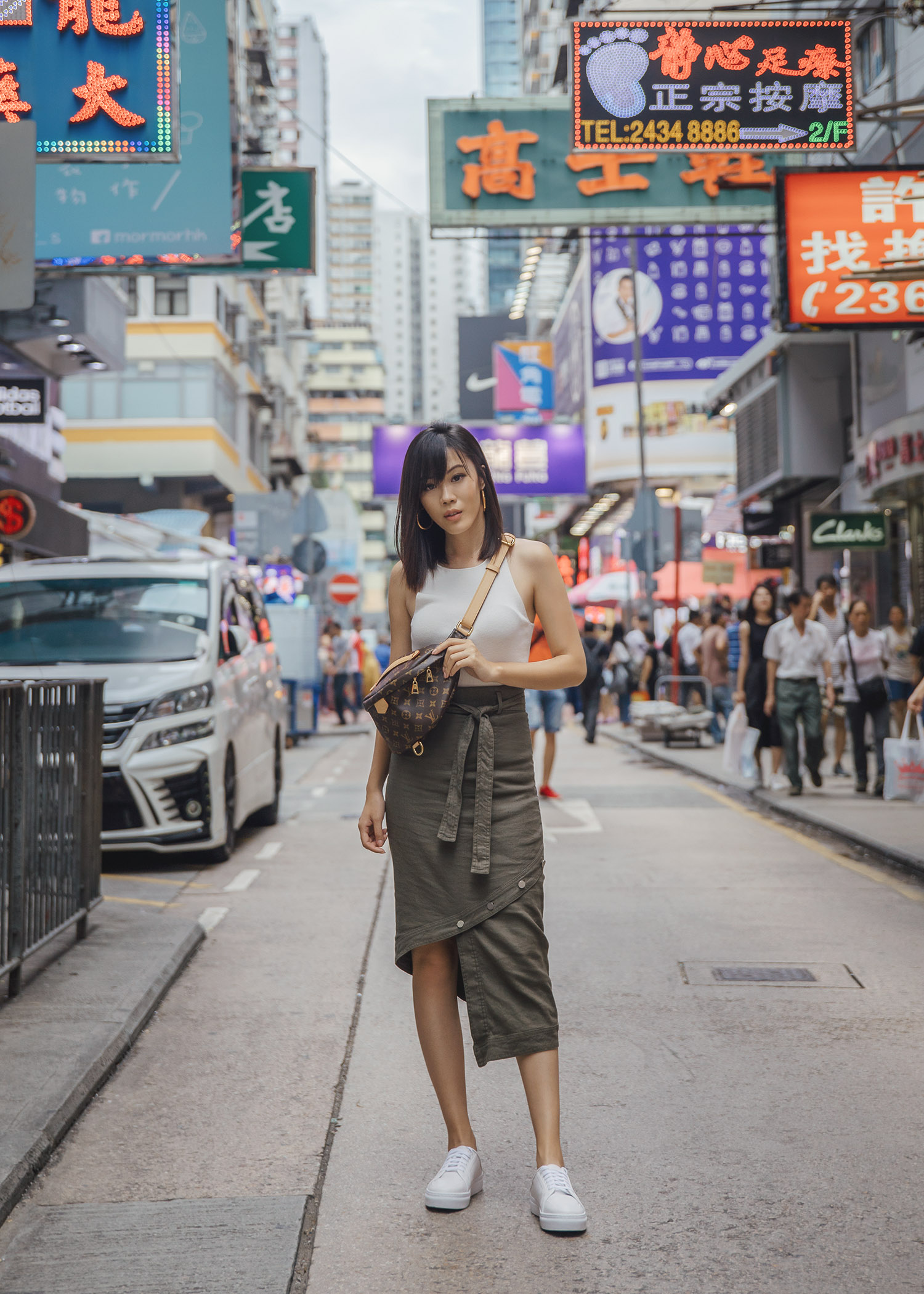 Jenny Tsang of Tsangtastic wearing Louis Vuitton bumbag styling belt bag in Hong Kong