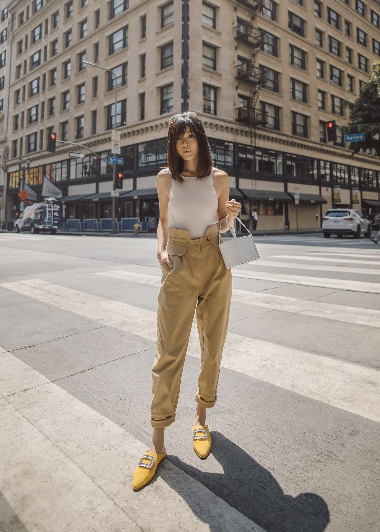 roger vivier bab viv mules in yellow suede with tank top with high-waisted pant