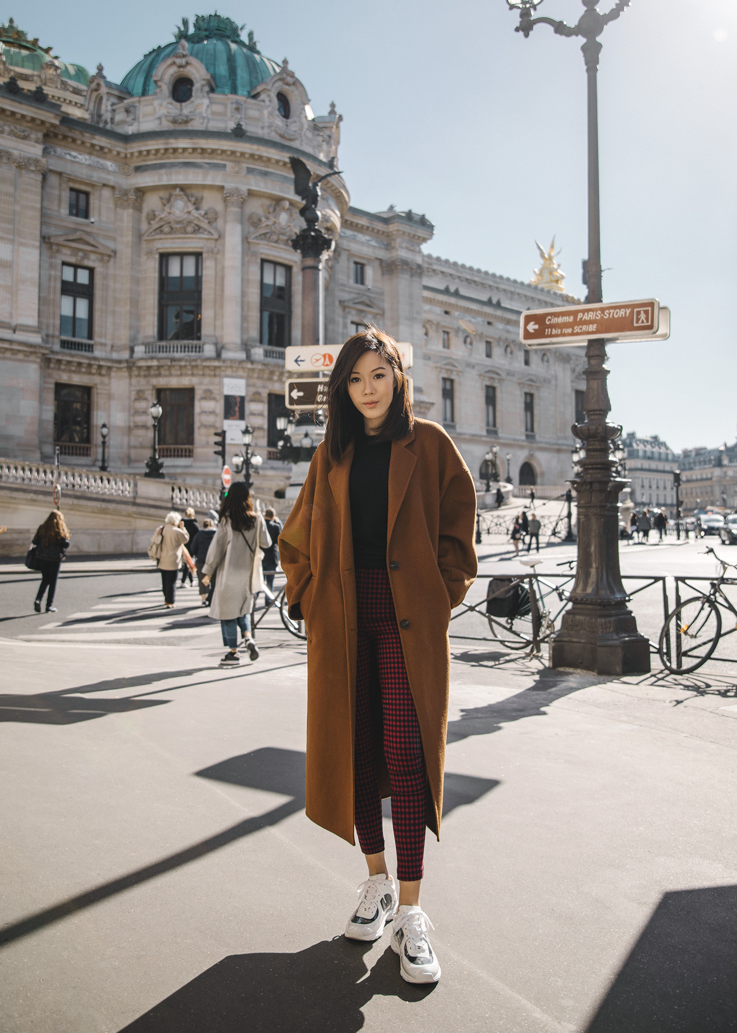 Jenny Tsang of Tsangtastic wearing brown oversized coat in Paris