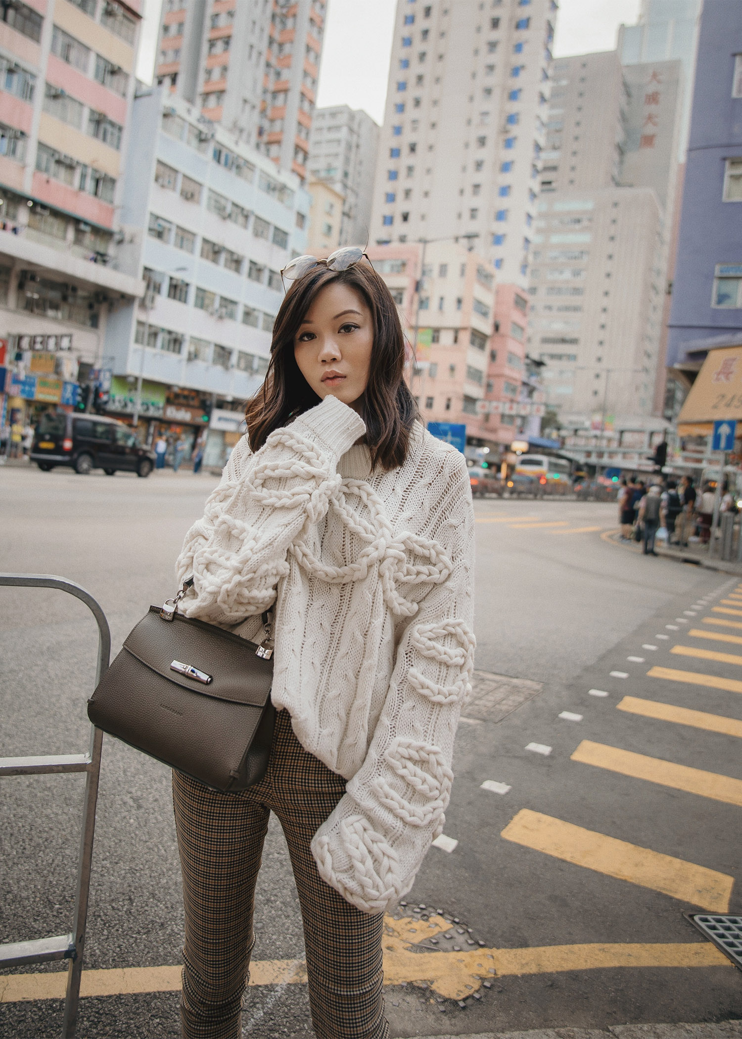 Jenny Tsang of Tsangtastic wearing designers remix cable knit sweater plaid skinny pants chanel sneakers longchamp MADELEINE bag in Hong Kong